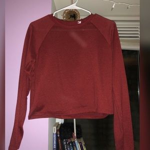 Long sleeved crop top. Burgundy red colored